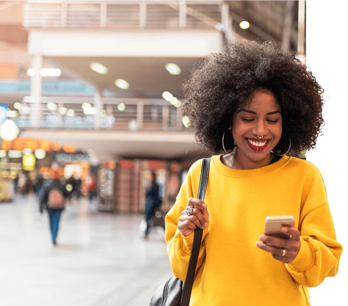 Woman smiling and using the YourParkingSpace App