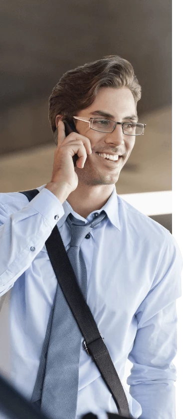 Man smiling and talking on the phone
