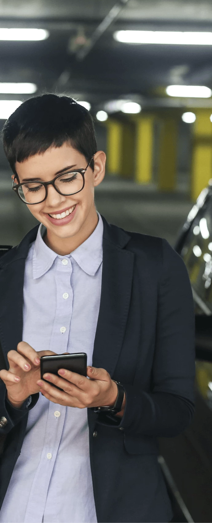 Woman using the YourParkingSpace app on her phone