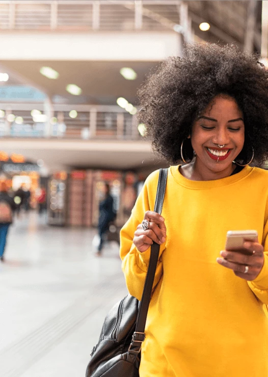 Woman smiling and using the YourParkingSpace app
